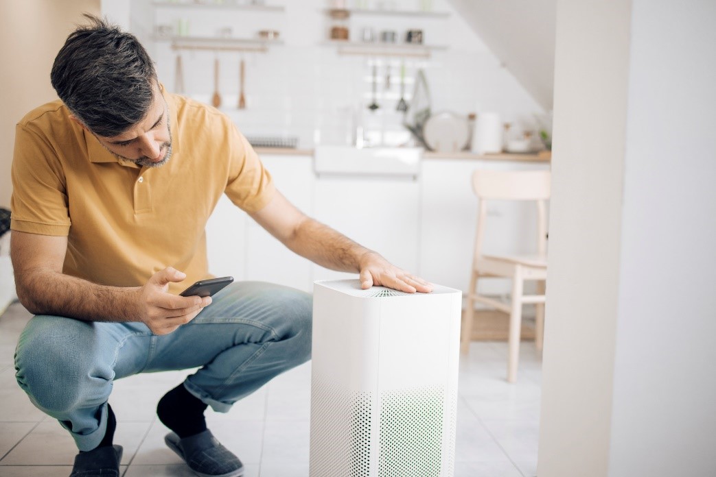 A man operating an air filtration unit | Air Filtration Systems